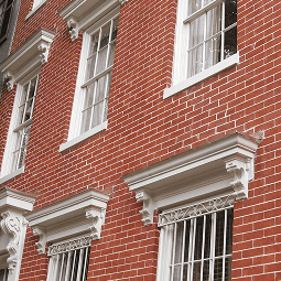 Historic brick building with detailed masonry and tuckpointing work.