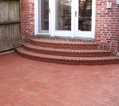 Beautiful brick steps and patio with detailed masonry work.
