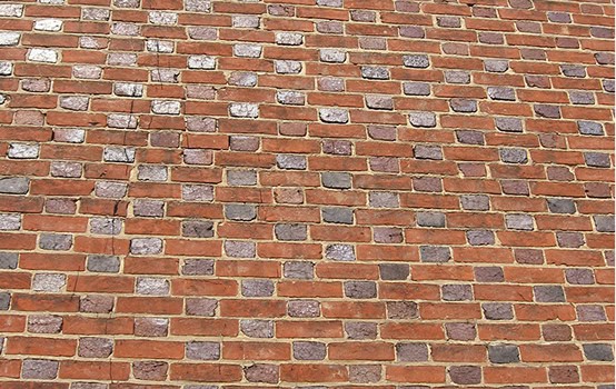 Detailed view of historic brick masonry and tuckpointing work.