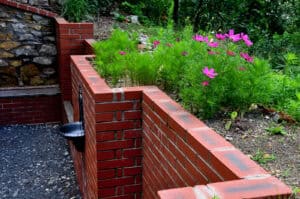 Beautiful brick masonry with fresh tuckpointing and garden landscaping.