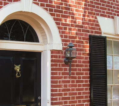 Close-up of historic brick masonry and tuckpointing on a building facade.