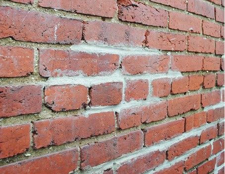 Close-up of historic brick masonry with tuckpointing work.