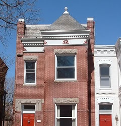 Restoring historic masonry and tuckpointing on a classic brick building. Expert craftsmanship in Ren.