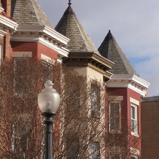 Historic masonry and tuckpointing work on a castle-style building.