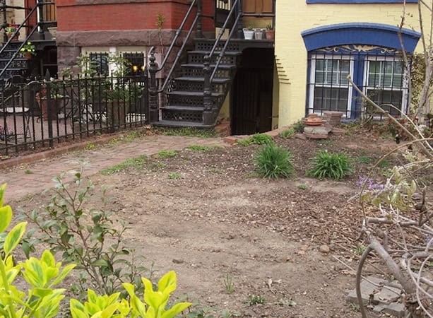 Restoring historic masonry and tuckpointing on a residential building's exterior.