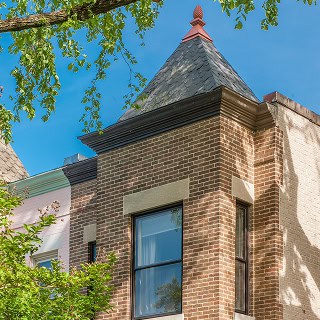 Historic masonry and tuckpointing work on a classic brick building.