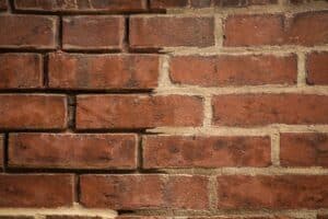 Tuckpointing old brick requires the use of lime mortar to preserve the authenticity and structural integrity of historic brick homes in DC.