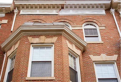 Close-up of historic brick masonry and tuckpointing on a Renaissance-style building.