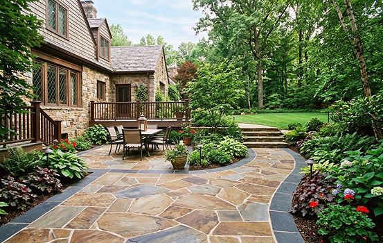 patio and walkways img 09 Stone patio with outdoor dining and lush garden