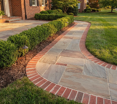 patio and walkways img 11 Curved stone walkway with brick border by lawn