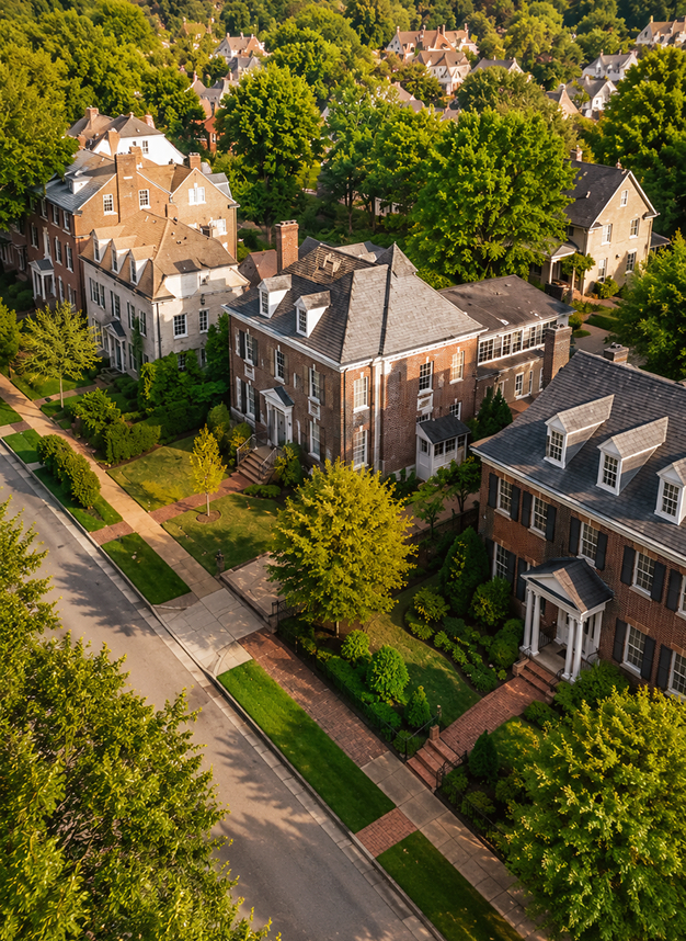 prince georges img Aerial view of tree-lined suburban brick homes