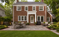thumb-img-00 Two-story brick colonial home with patio and lawn